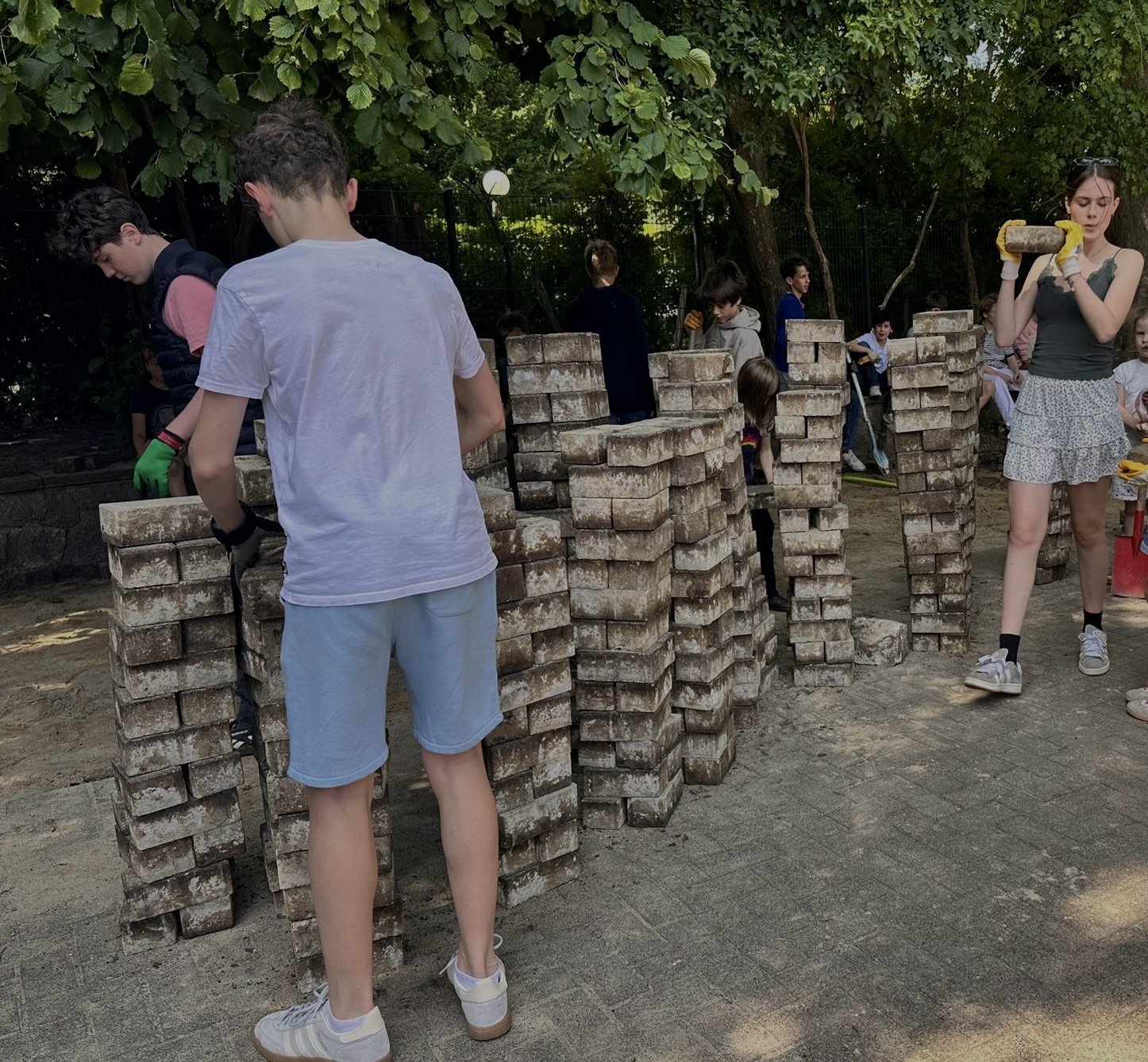 picture of young people removing stones from the ground